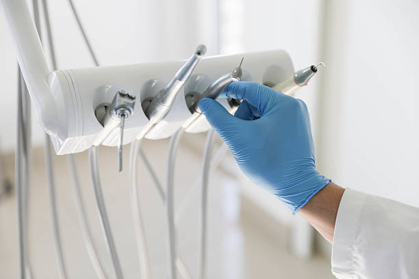 Professional Tooth Extraction technician working in San Castle, FL